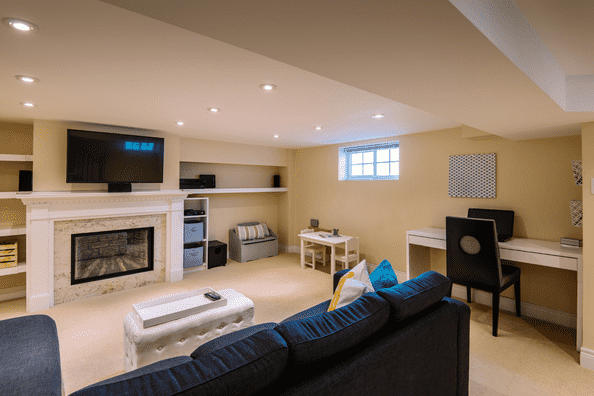 Renovated basement with modern design and fireplace in Calgary