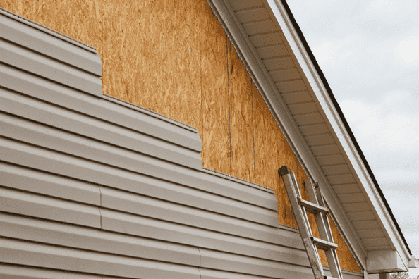 House exterior undergoing siding installation in Calgary
